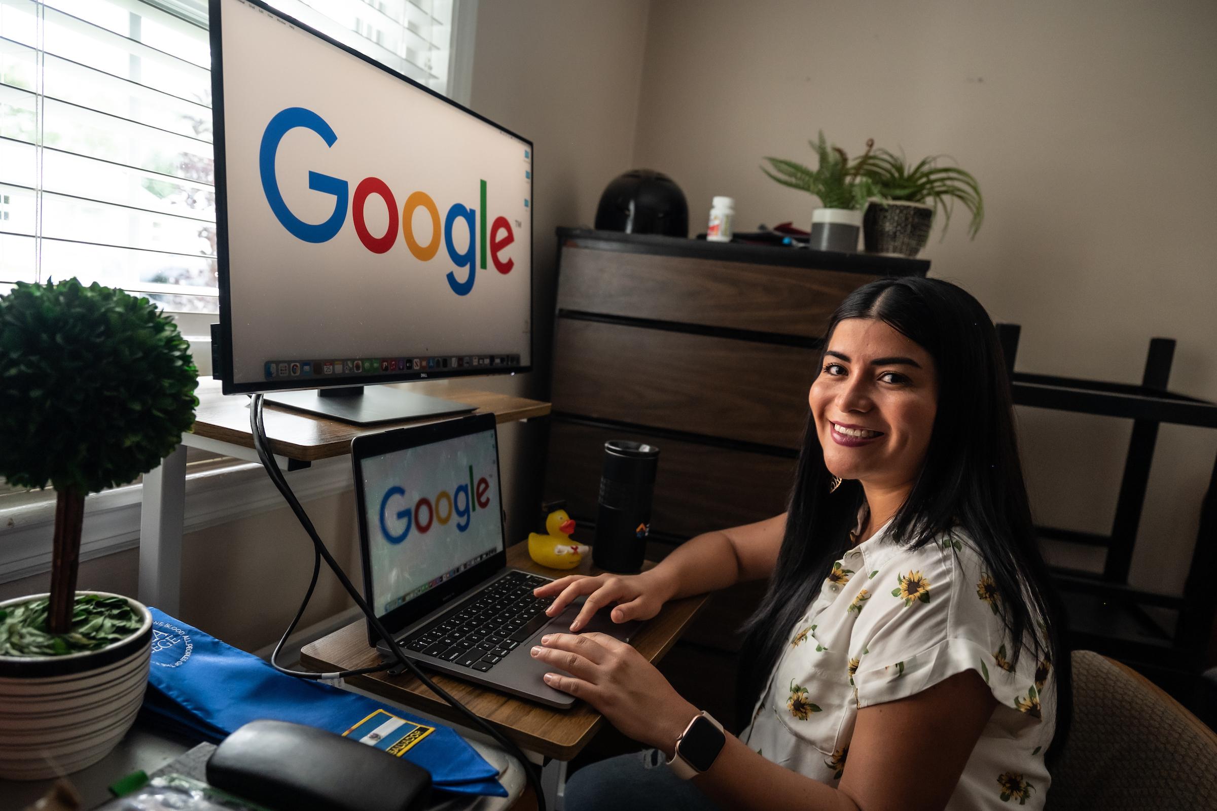Emely Zavala at desk with Google on screen
