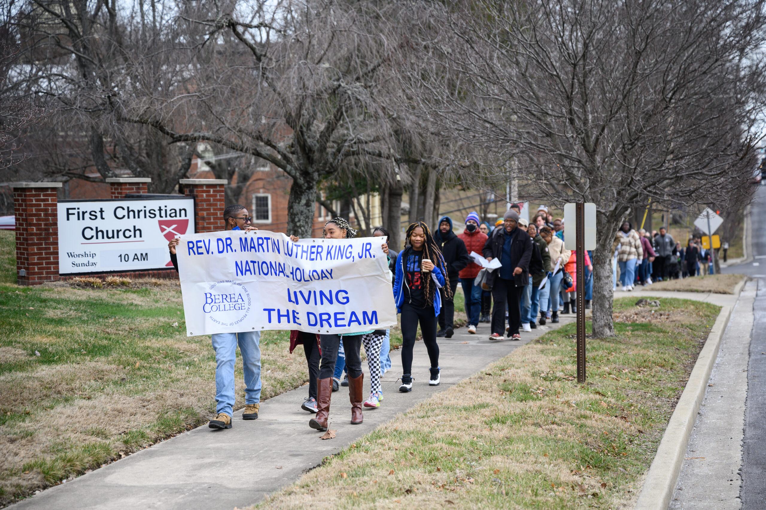 A Berea College crowd of faculty, staff, and students marching to First Christian Church for the Martin Luther King Day.